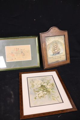 three framed pictures of flowers and a ship on a black background