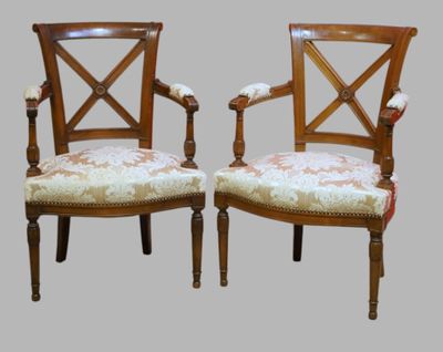 pair of antique wooden chairs with upholstered arms and upholstered arms
