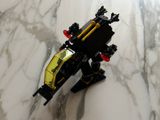a toy car that is sitting on a marble surface