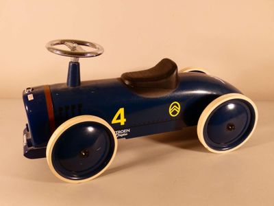 a blue toy car with a steering and a steering wheel