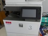 a printer sitting on a table in a room
