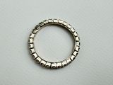 a close up of a silver ring on a white surface