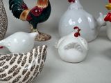 many different types of ceramic figurines sitting on a table