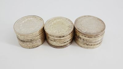 three stacks of coins sitting on top of each other