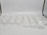 many empty wine glasses sitting on a white table
