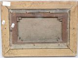 an old picture of a picture frame on a wall with a tag on it