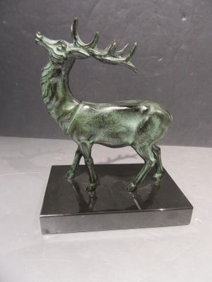 bronze sculpture of a stag on a marble base