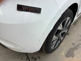 a sticker on the back of a white car