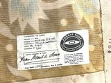 a close up of a piece of fabric with a label on it
