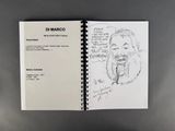 drawing of a man ' s face in a notebook with a pen