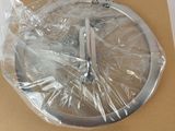 a clock that is wrapped in plastic on top of a box