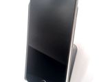 a cell phone that is sitting on top of a stand