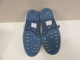 pair of blue and white slippers on a white surface