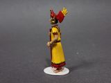 figurine of a woman in a yellow dress with a red bird on her head