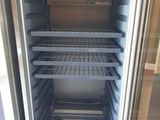 an open refrigerator with a lot of food inside of it