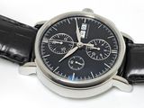 a close up of a wrist watch with a black dial