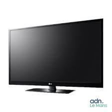 a black flat screen tv sitting on top of a white table