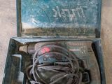 a tool in a case that is sitting on the floor