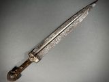 an image of a knife that is laying on a table