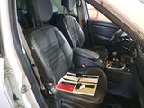a picture of the inside of a car with black leather seats