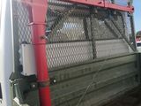 a truck that has a cage on the back of it