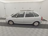 a picture of a small white car in a garage