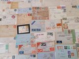 many different types of letters and envelopes laid out on a table