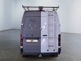 a van that has a ladder on the back of it