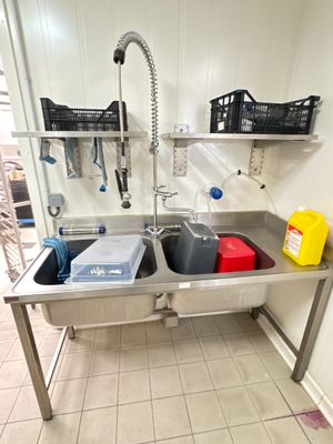 a kitchen sink with a sink and a faucet in it