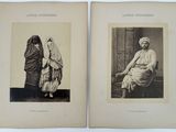 an old black and white photo of two women in traditional clothing