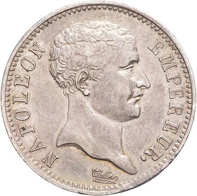 a close up of a coin with a man ' s face on it
