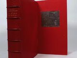 the red book is open to show the inside of it