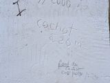 a sign on the side of a building that says it ' s 7 00am
