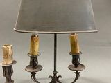 pair of silver plated table lamps with shades on each of them