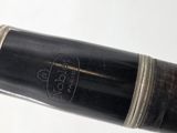 a close up of a pipe with a black handle