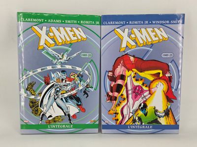 two books of x - men comics on a white surface