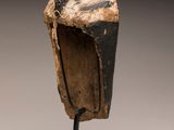an image of a wooden sculpture of a bird on a stand