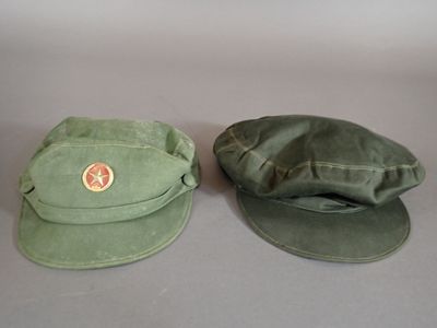 two hats that are sitting next to each other on a table