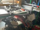a picture of a cluttered garage with tools and equipment