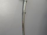 an old sword is hanging on the wall in a room