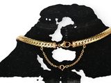 an image of a black and white silhouette of a man with a chain around his neck