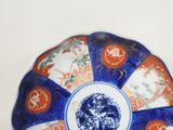a blue and white plate with a picture of a horse on it