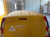 a yellow van that is parked inside of a building