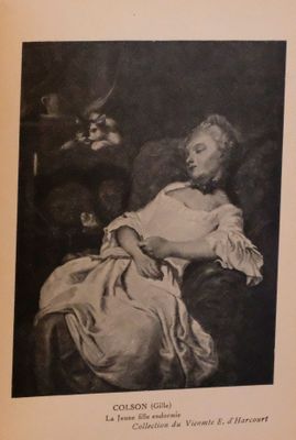 an old black and white photo of a woman laying on a couch