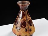 a vase that is sitting on a white table