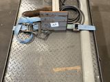 a machine that is sitting on a table in a warehouse