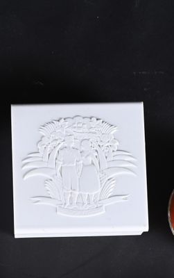 a picture of a soap dish and a soap dish on a black surface