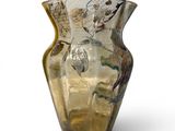 a glass vase with a design on it on a white background