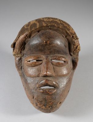 an image of a wooden mask on a white background