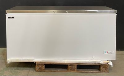 an image of a white chest freezer on a pallet